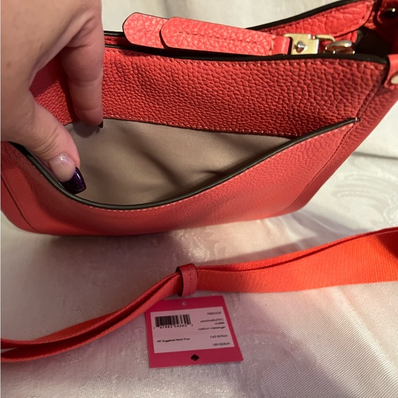Kate Spade peachmelba “Roulette” medium pebbled leather messenger bag